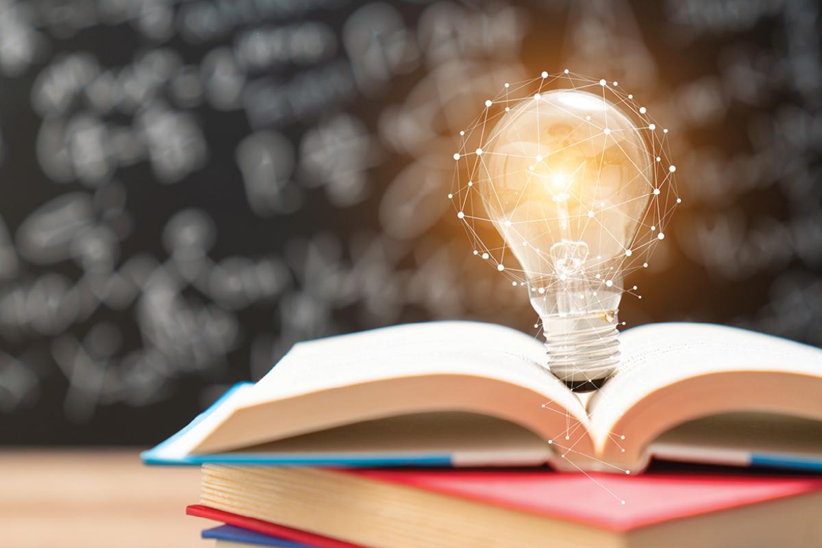 Lightbulb on an open book
