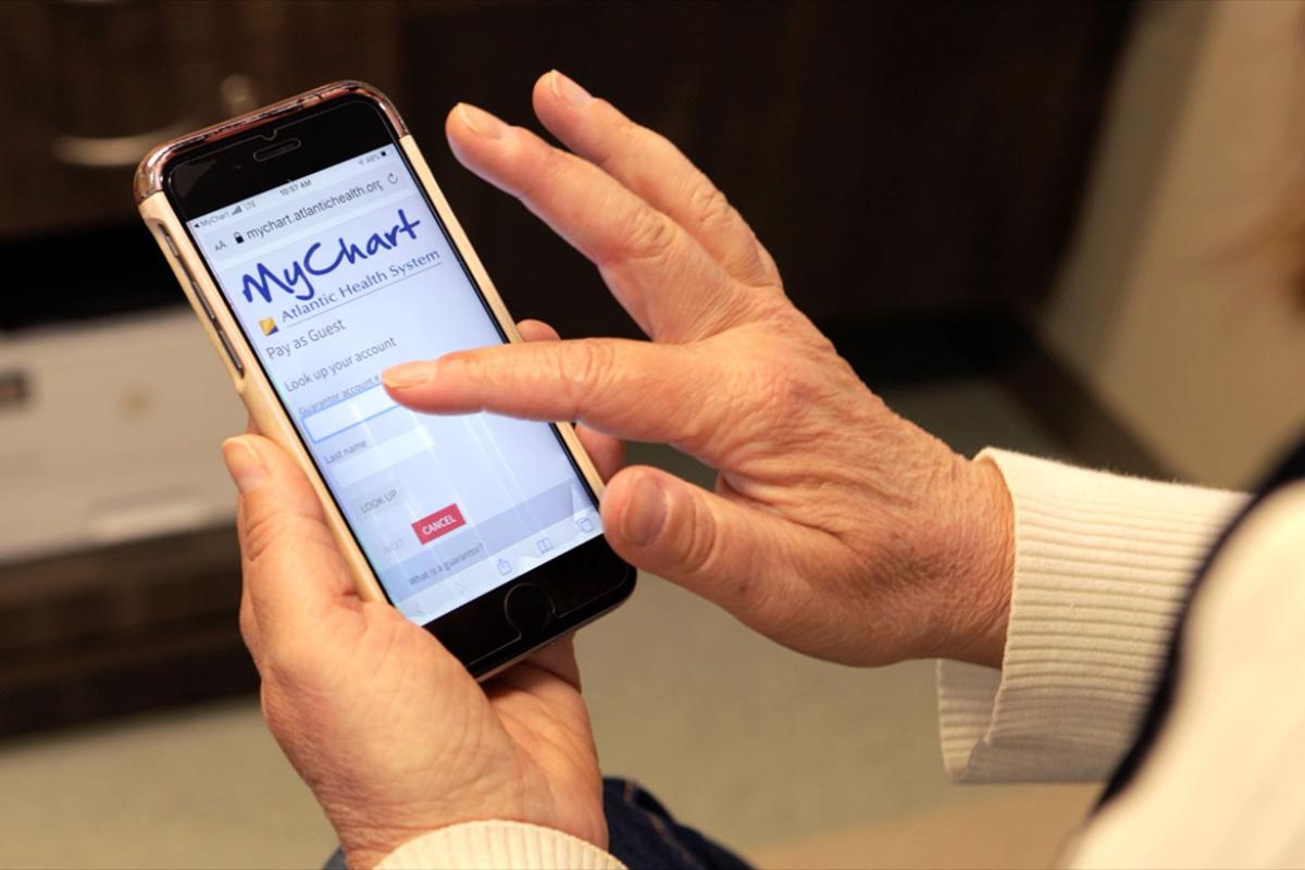 Close up using smart phone to check Atlantic Health Systems