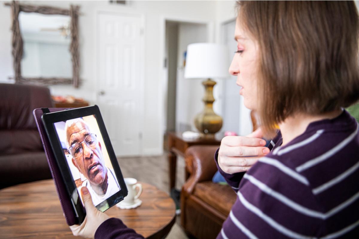 Person consulting a physician via a tablet