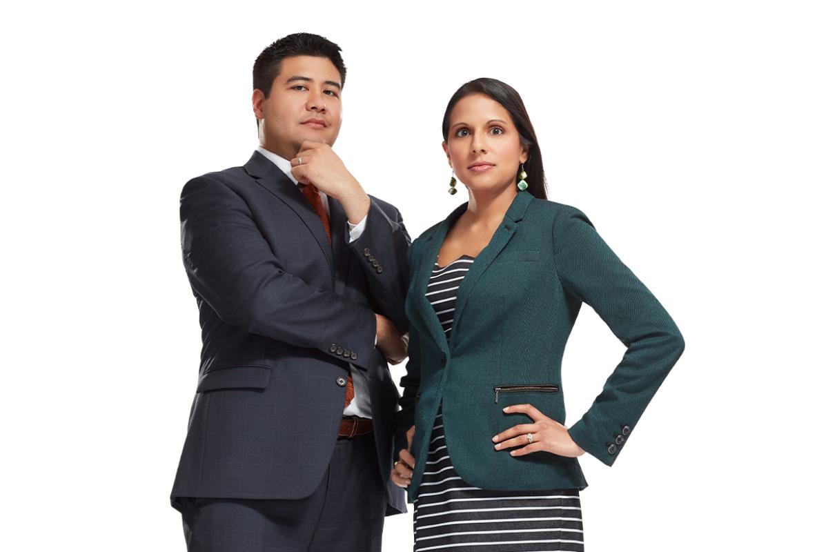 Photo of husband and wife, Hans Arora, MD and Kavita Arora, MD, MBE, MS, standing.
