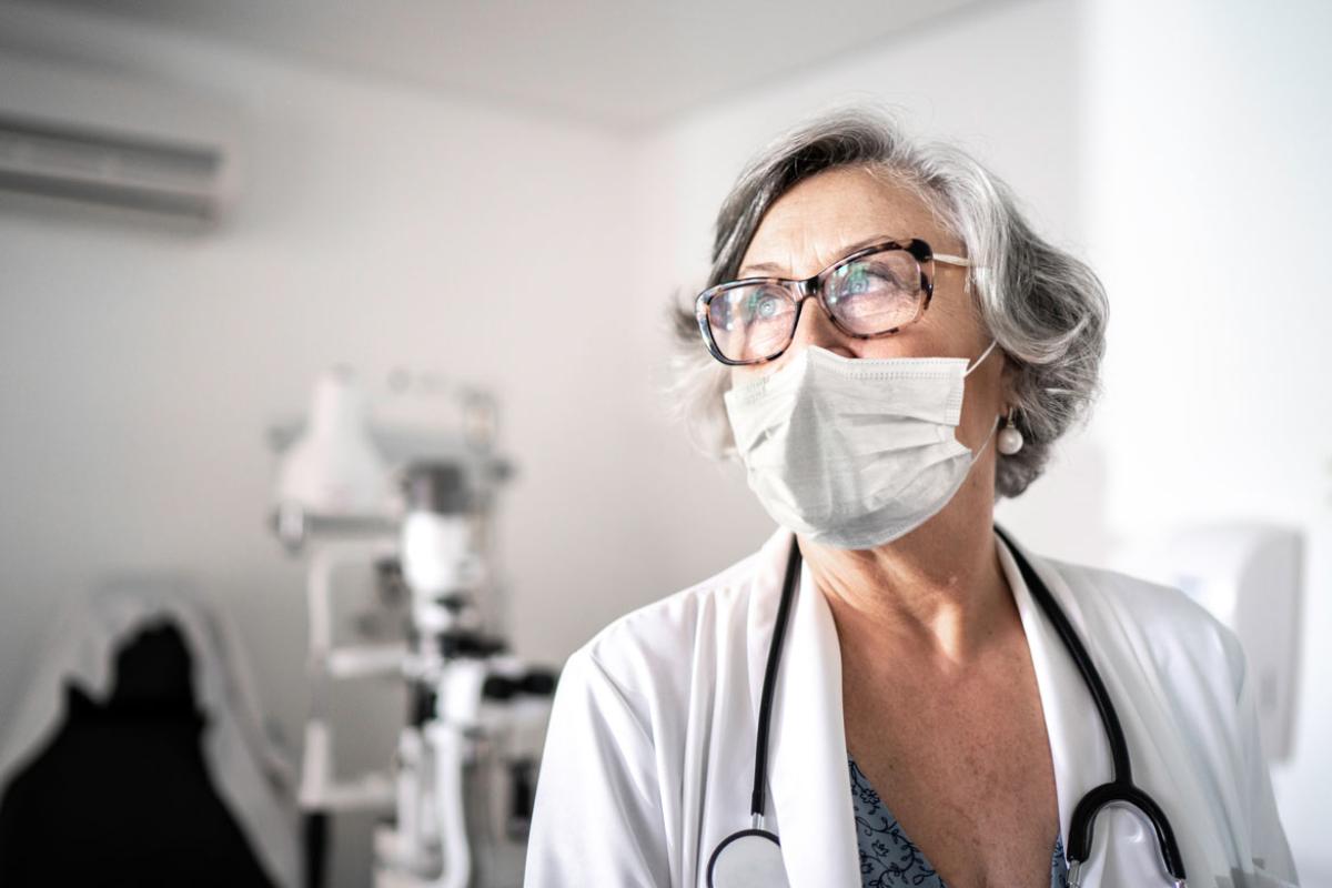 Woman physician wearing a face mask