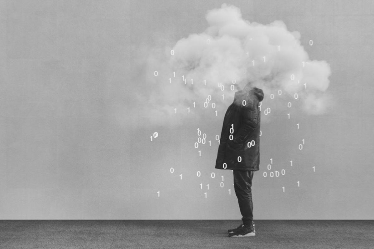 Photo illustration of a person with their head in a "data cloud" of ones and zeroes.