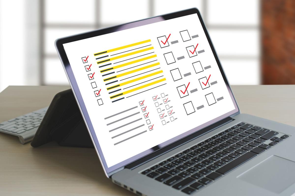 Laptop with checked boxes.