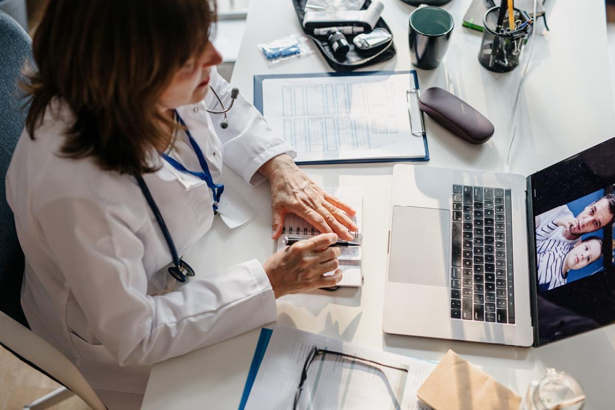 Physician working on a laptop