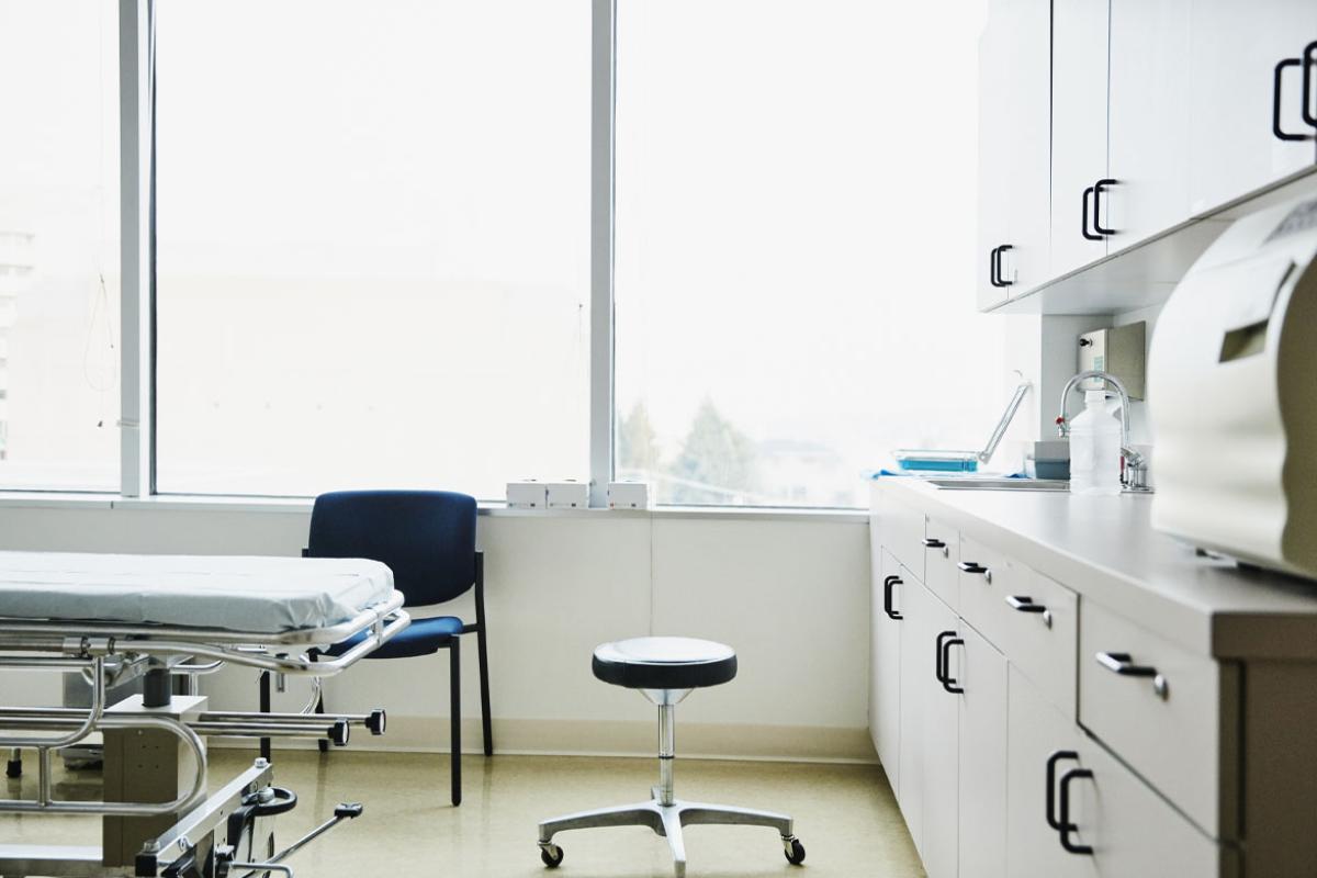 An empty, brightly lit examination room.