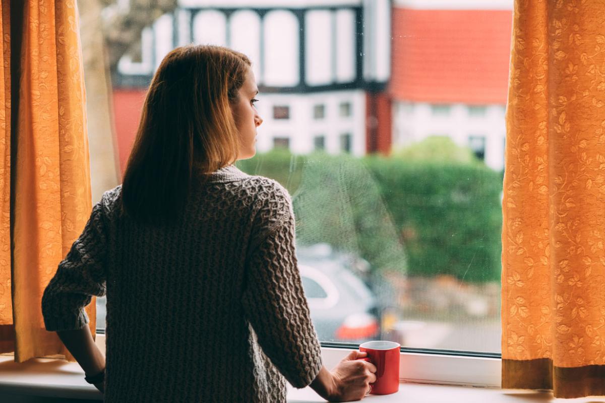Woman looking out a window