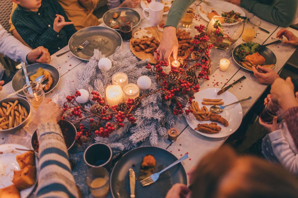 Family gathered around a dining room table for the holidays.