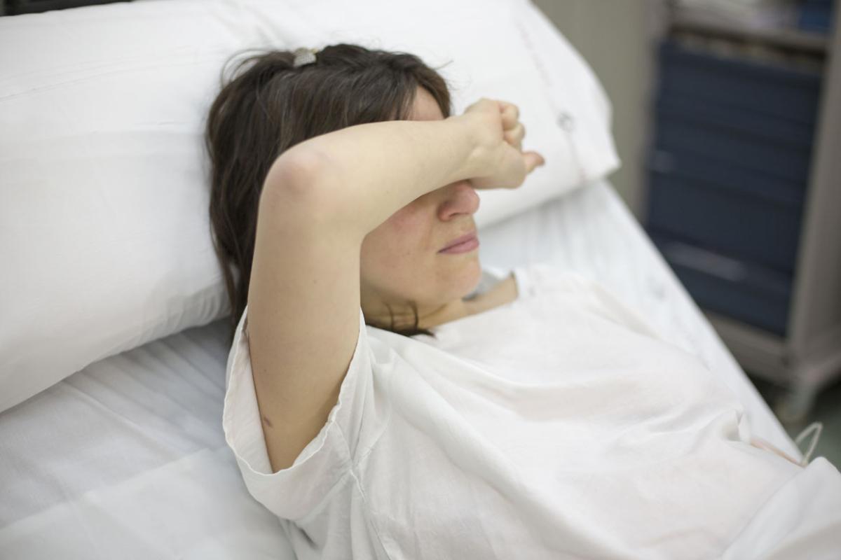 Woman in hospital bed
