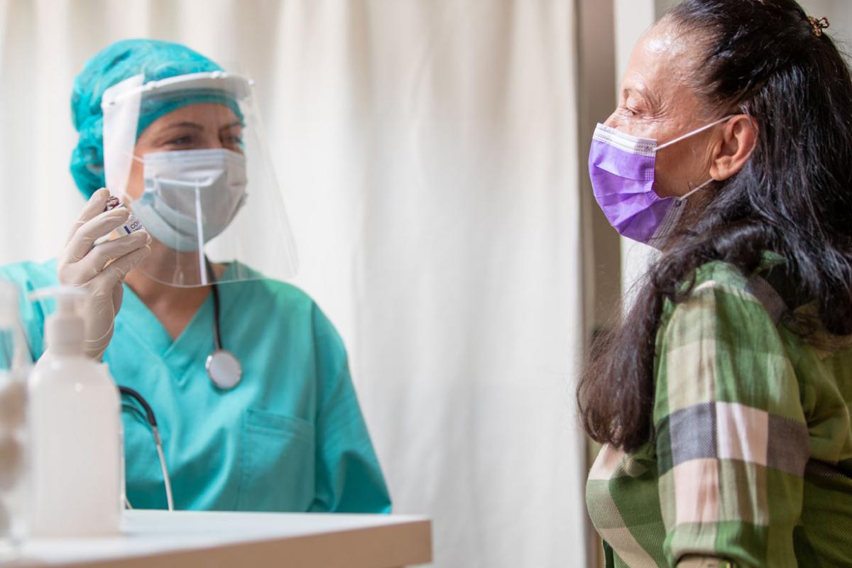 Health care worker and patient in PPE