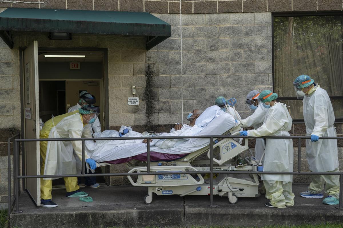 Health care workers transferring a patient