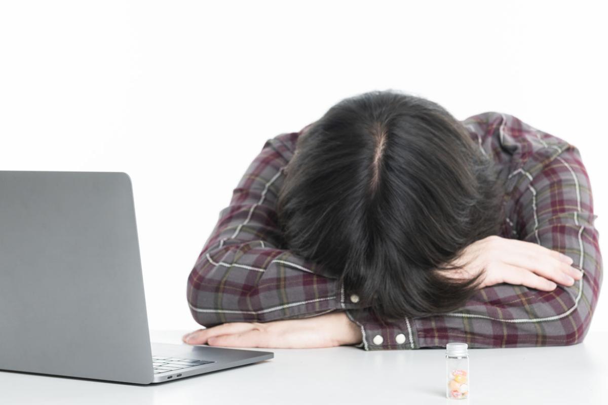 Student with head on desk
