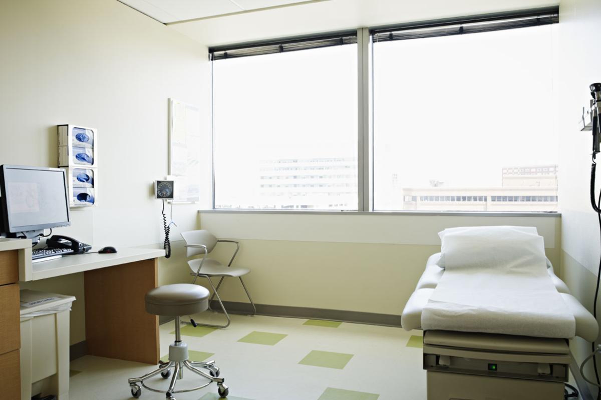 A very well lit, empty examination room.