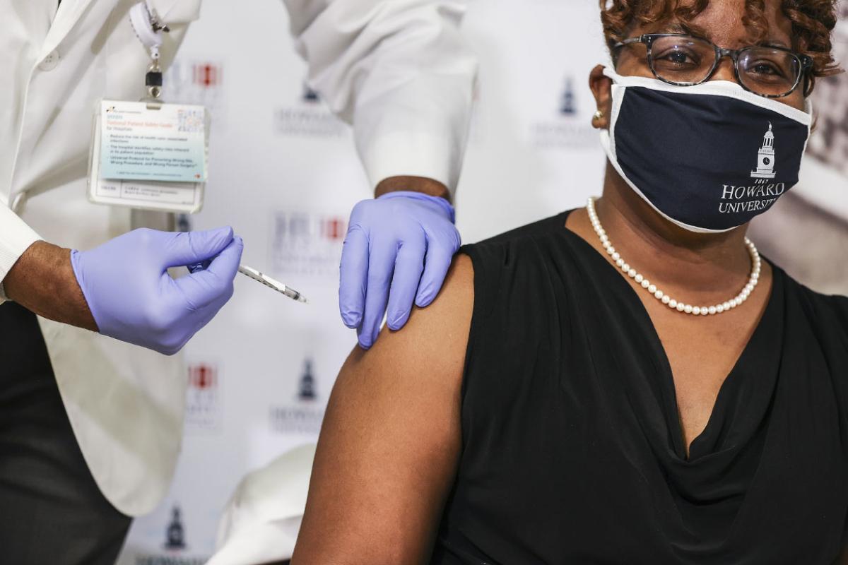 Person receiving a vaccine.