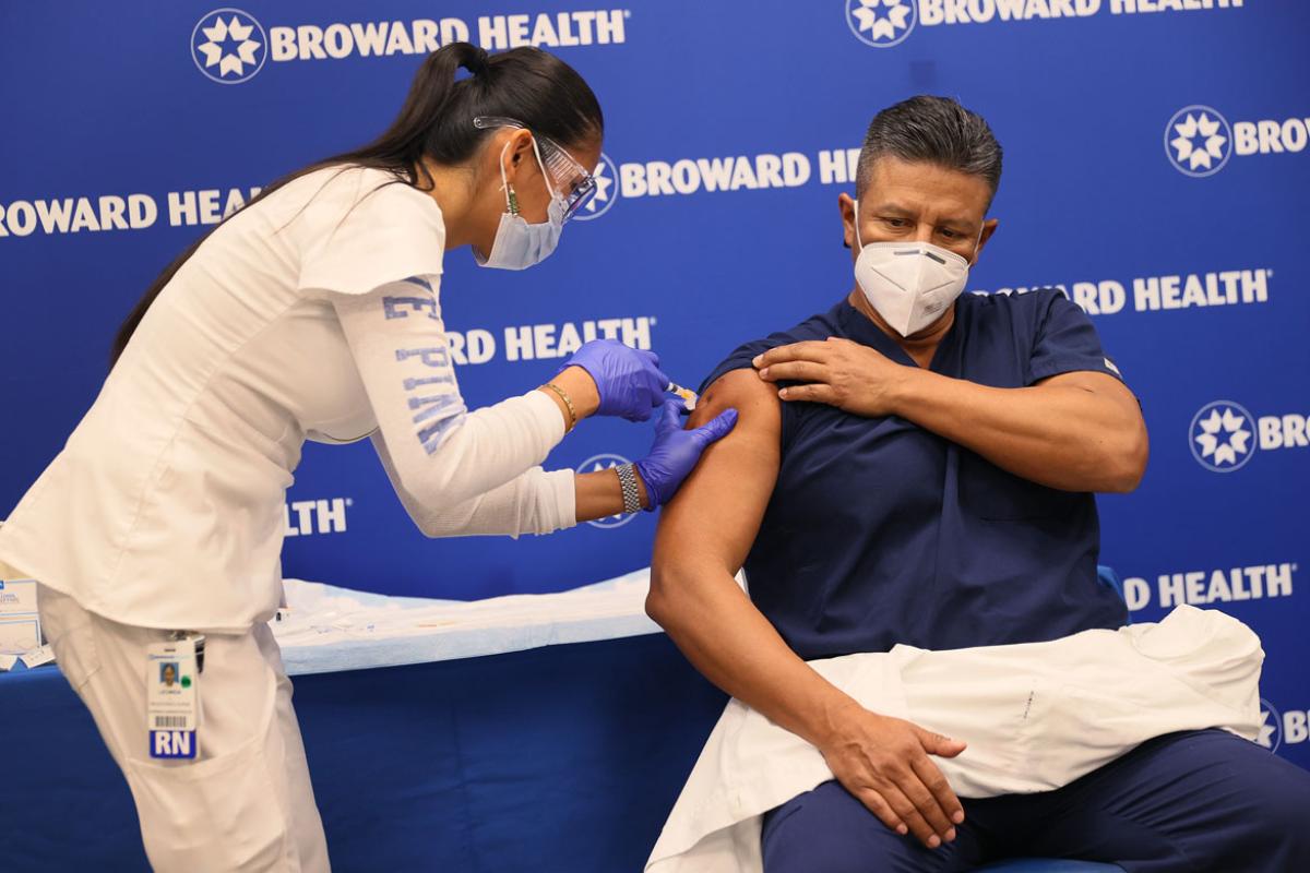 Person receiving COVID-19 vaccine