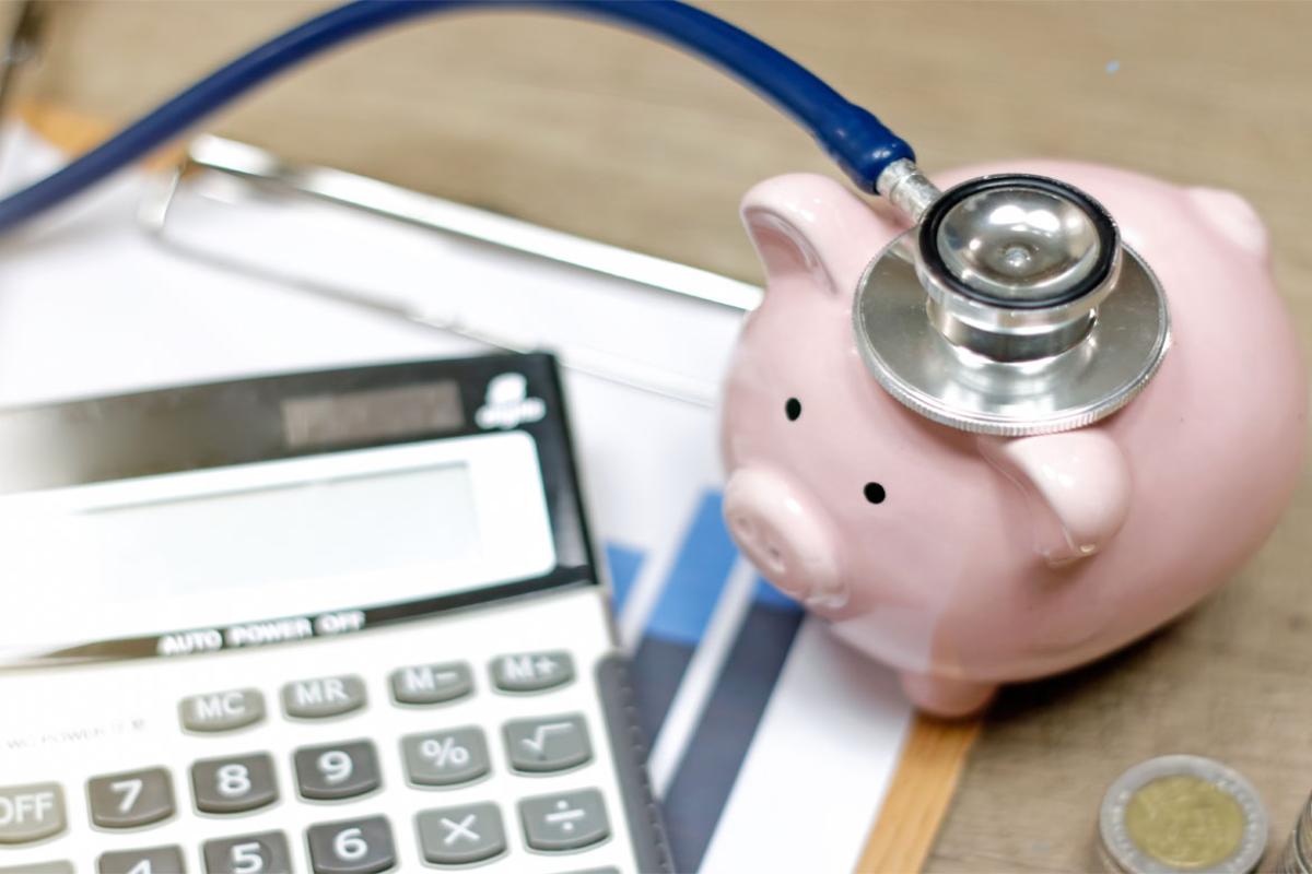 Stethoscope on piggy bank