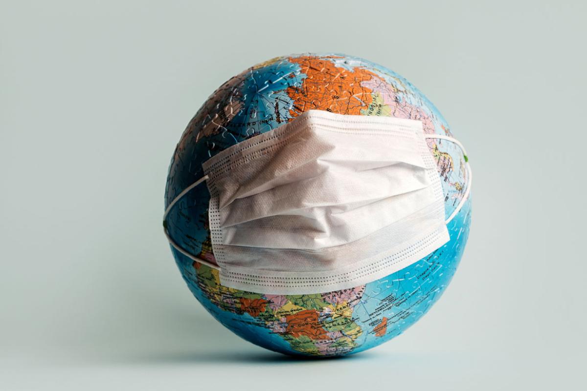 Face mask on a globe