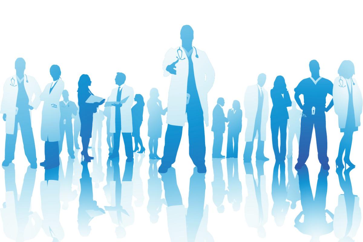 Silhouetted health care professionals one figure standing with hands outstretched.