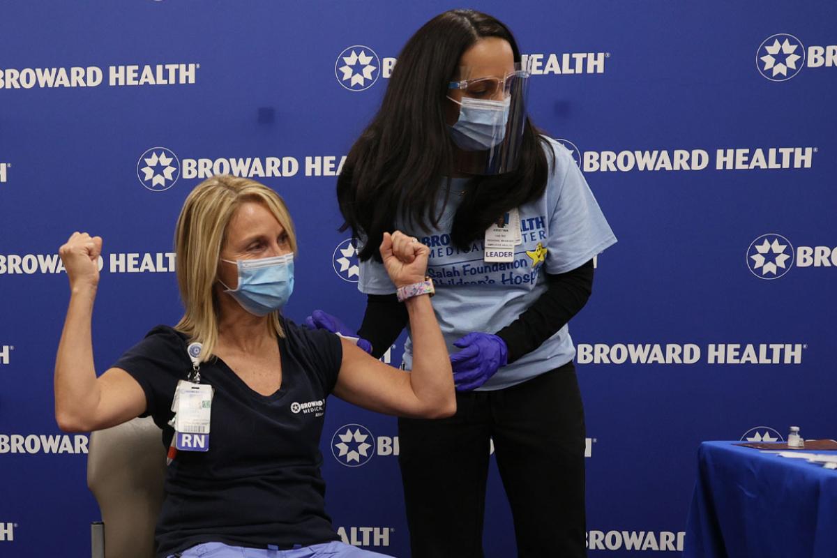 Health care worker receives COVID-19vvaccine