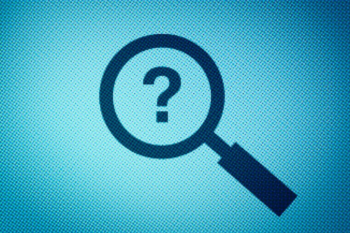 Question mark inside a magnifying glass