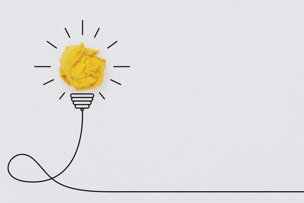 Crumpled yellow ball that looks like a light bulb