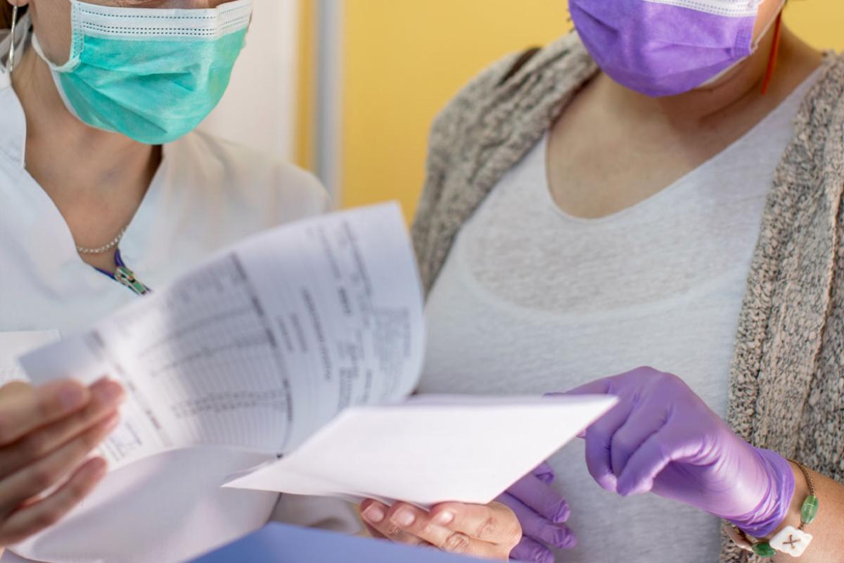 Health care workers reviewing documents
