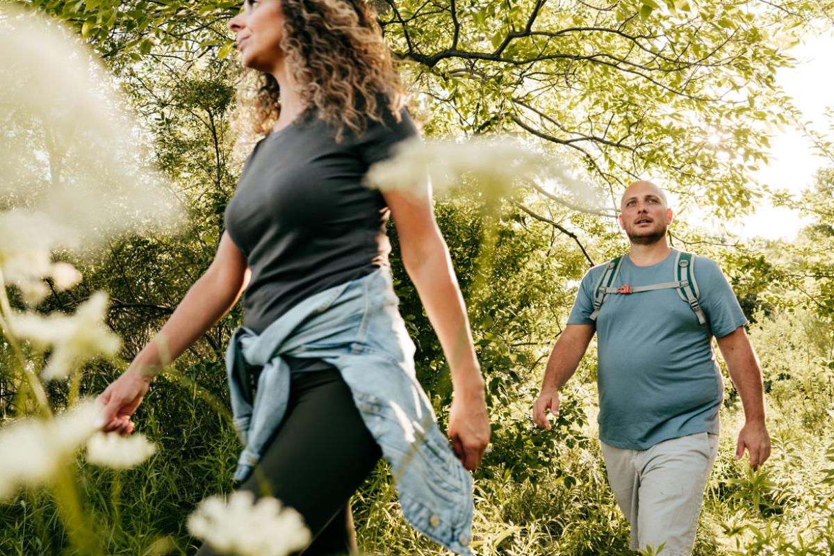 Two people walking outside