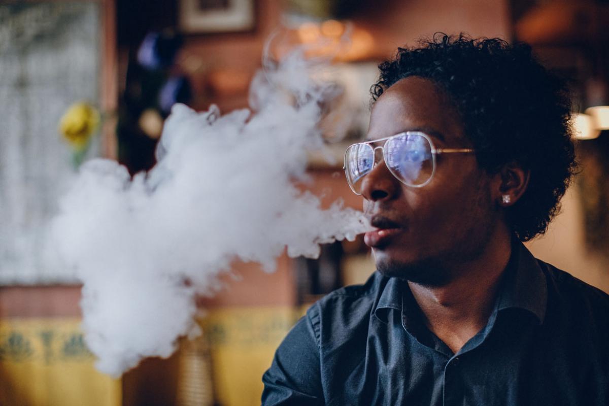 Person smoking an e-cigarette