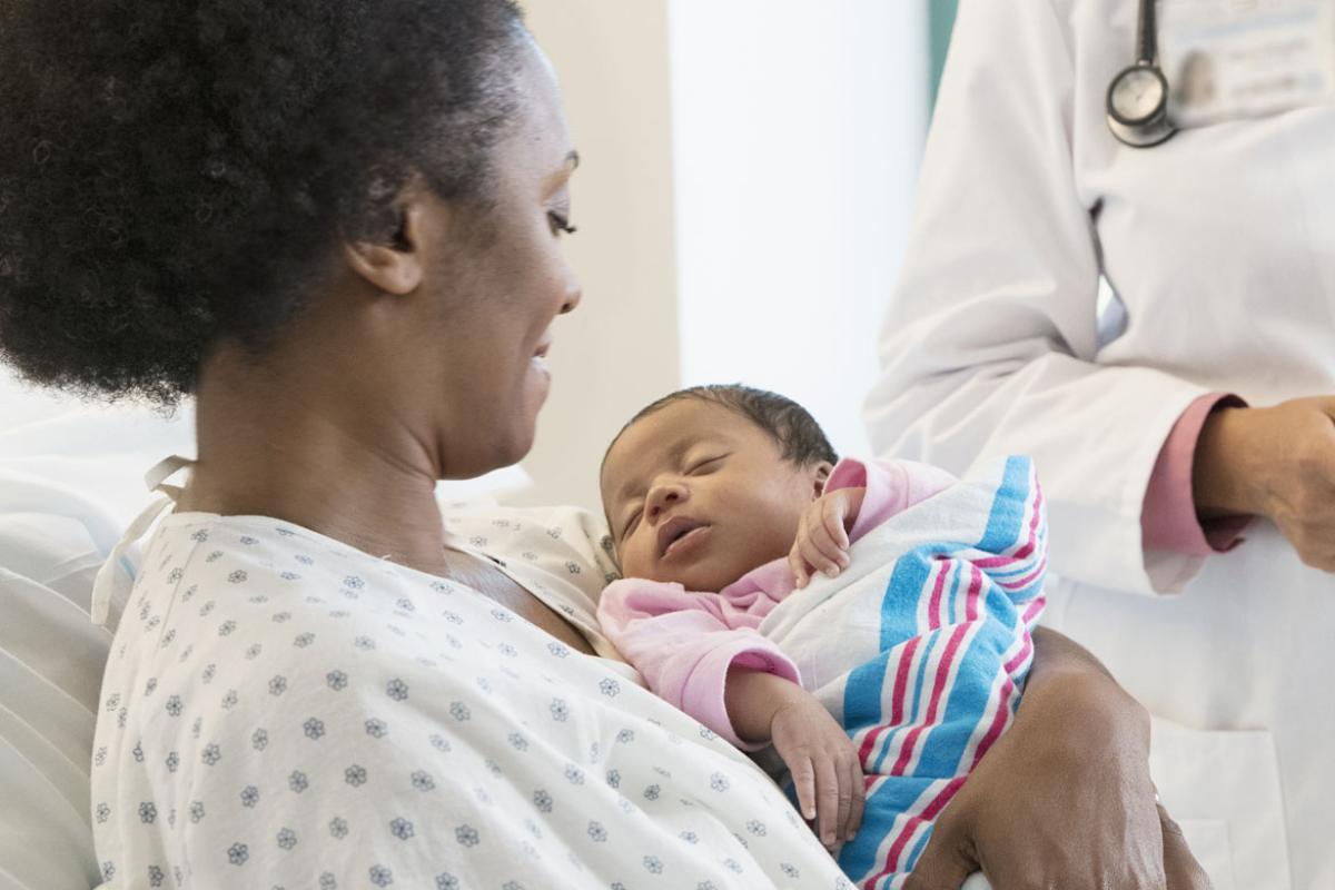 Woman holding an infant