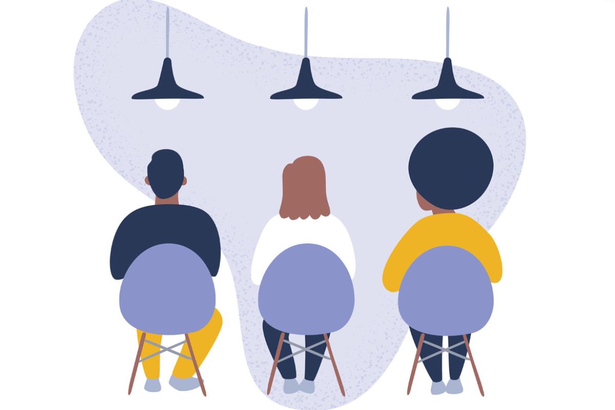 Three people sitting in chairs