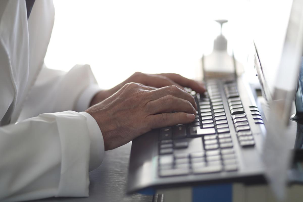 Hands typing on a keyboard