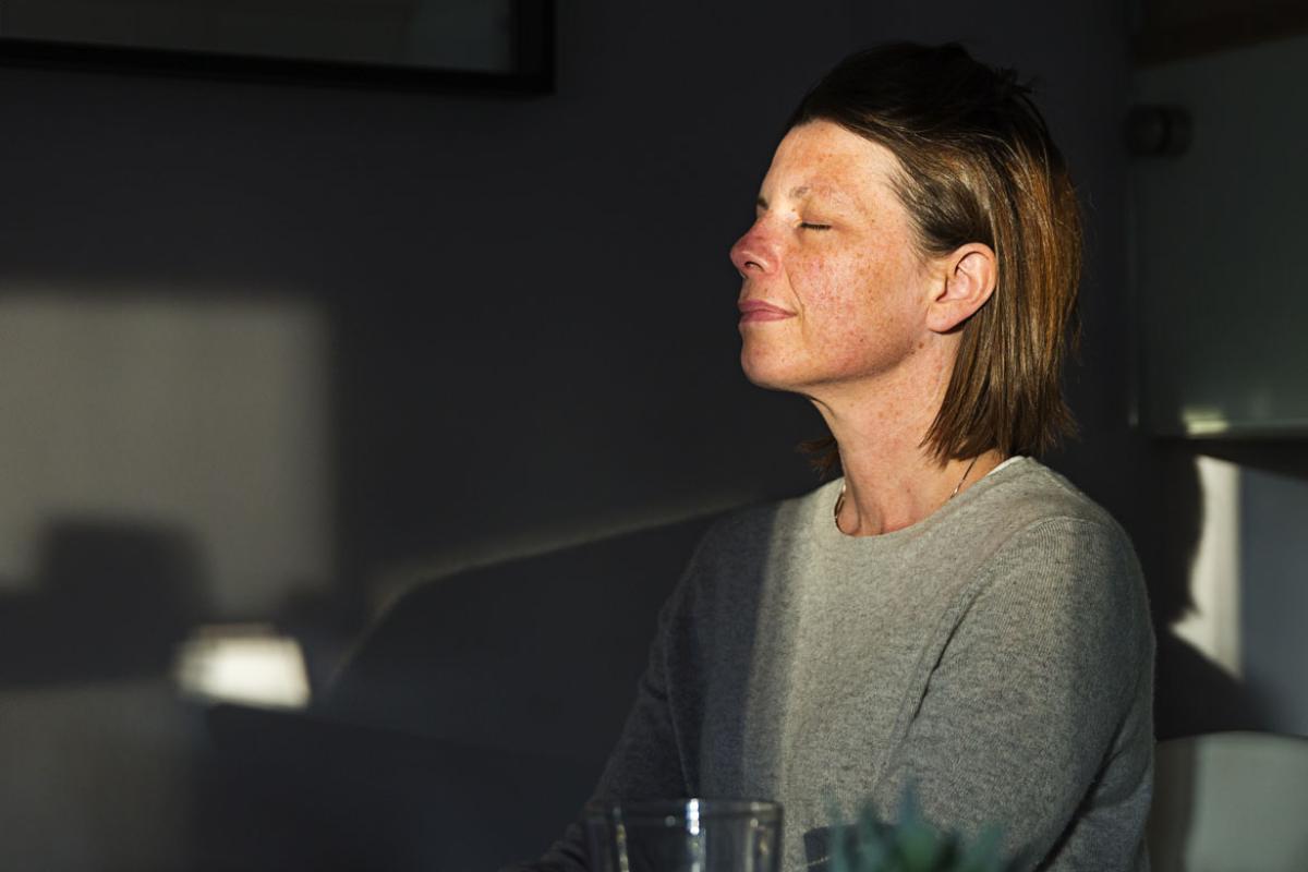 Person sitting with eyes closed