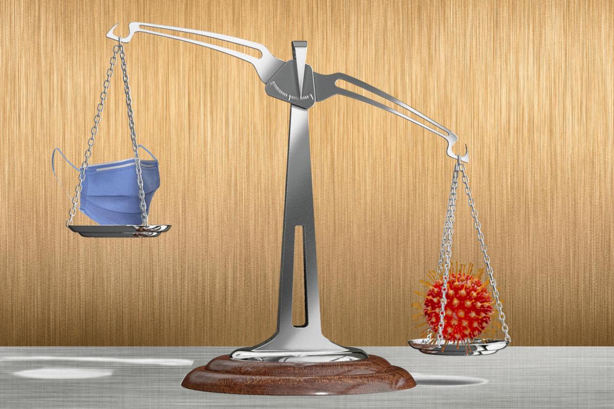 Scale balancing a face mask and coronavirus
