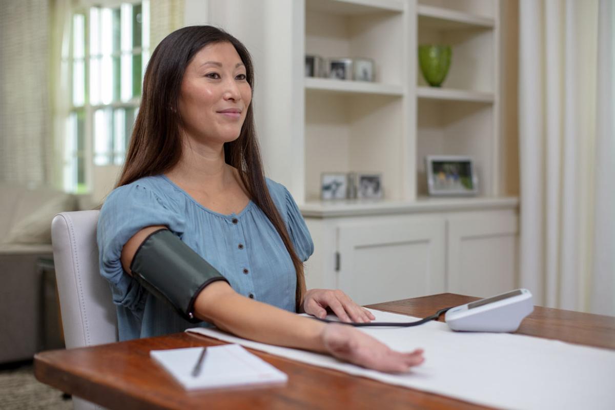 Person monitoring blood pressure in home