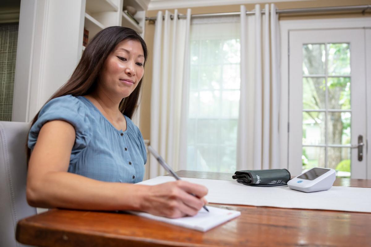 Person monitoring blood pressure in home