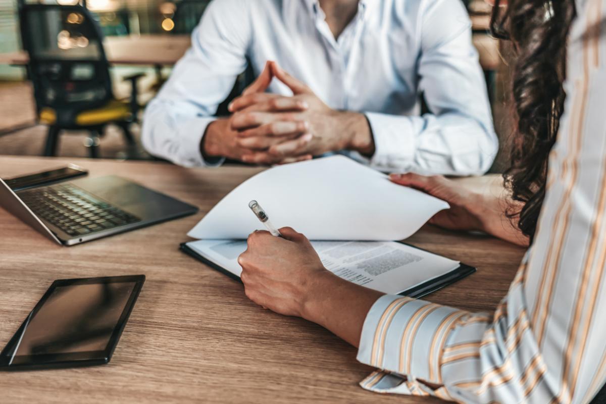 Two people looking at documents