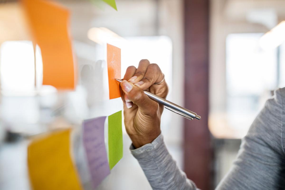 Person working at a white board