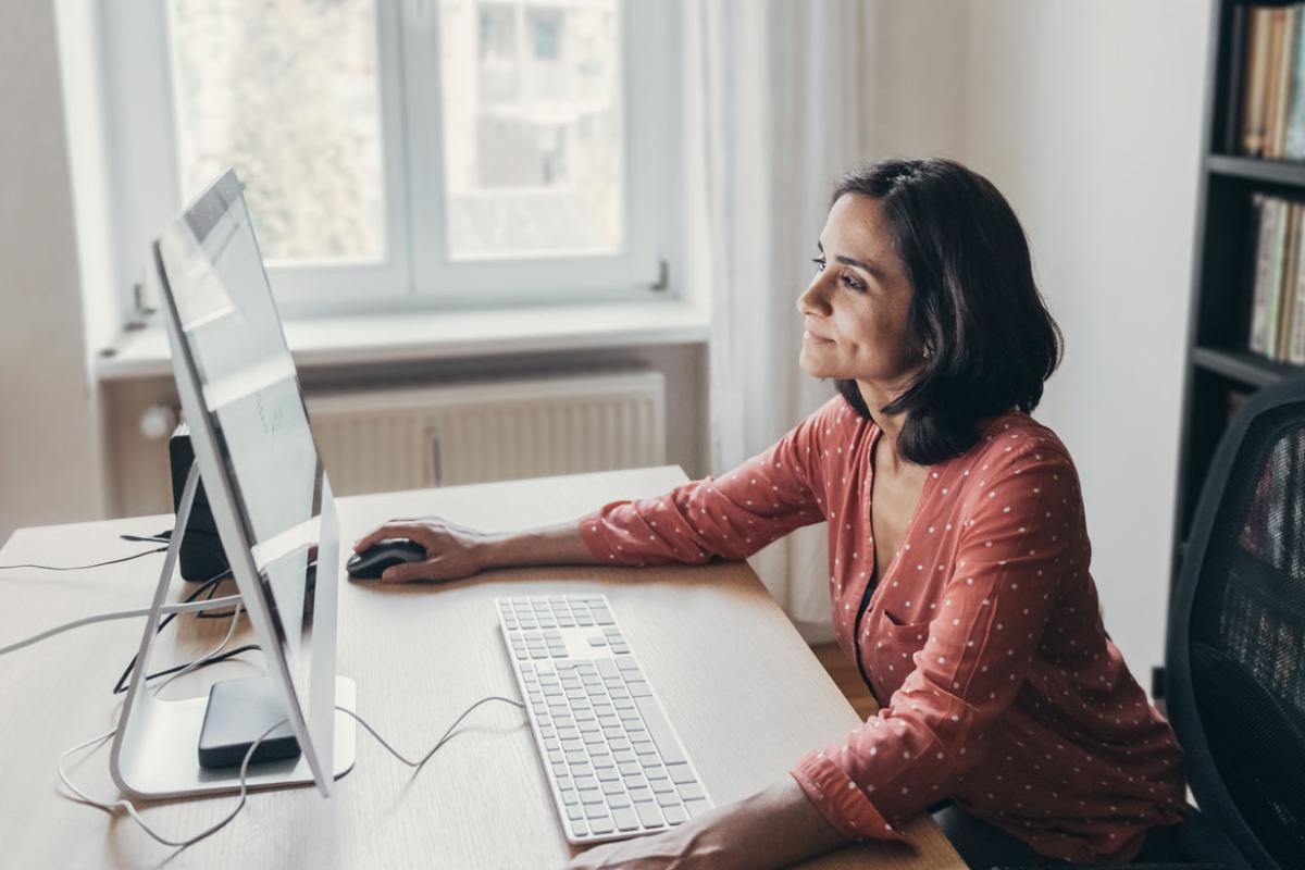 Person working in front of a desktop computer