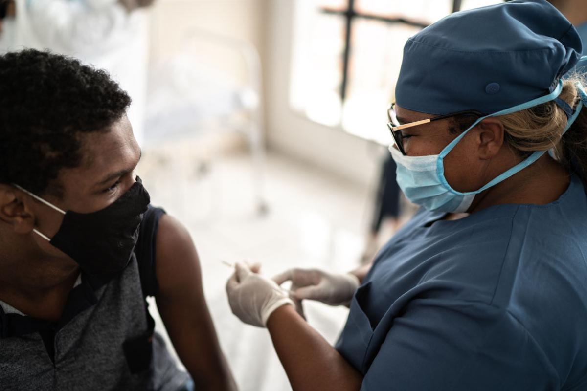 Person about to receive a vaccine