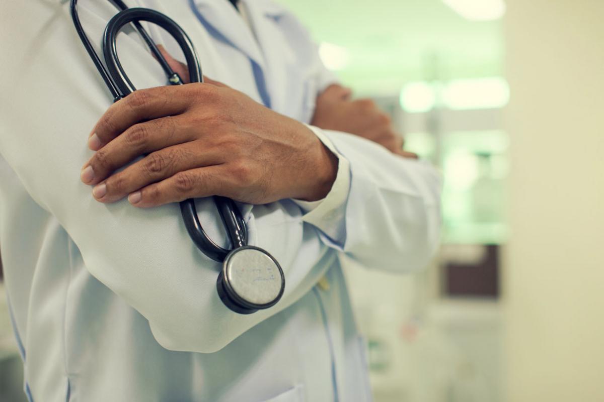 Physician with arms crossed