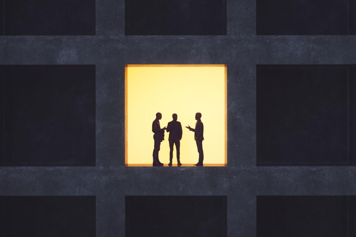 Silhouettes of three figures
