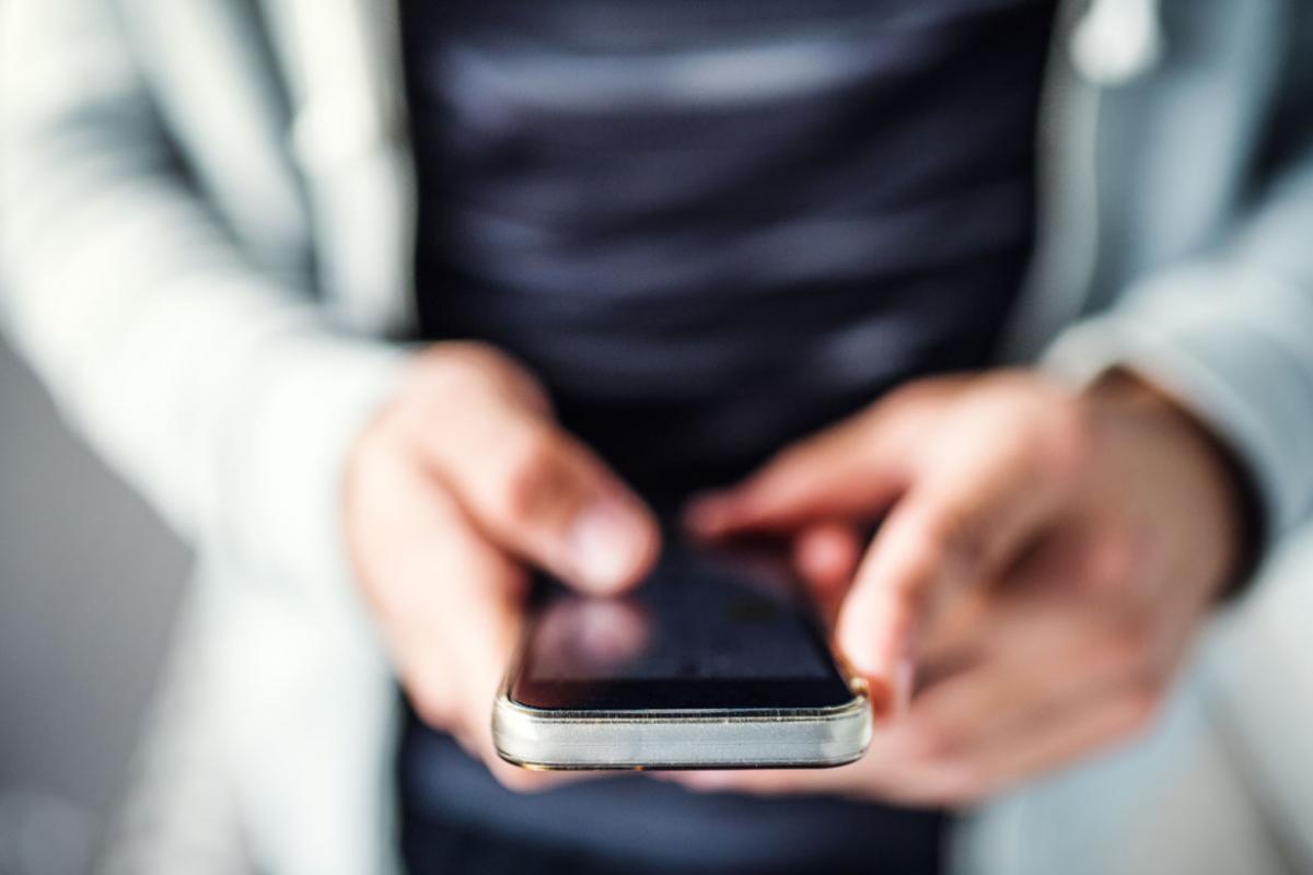 Hands holding a smartphone