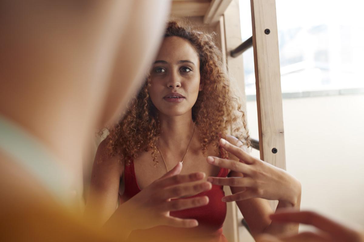 Young woman talking and gesturing with her hands
