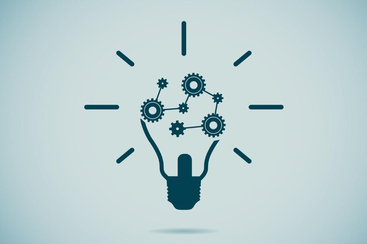 Illustration of a dark grey lightbulb, with the inner workings replaced by a series of gears.