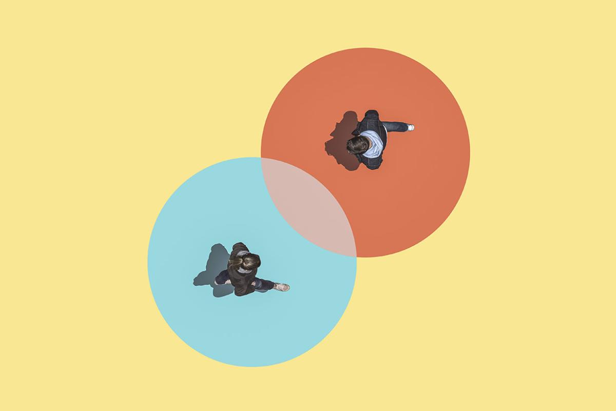 Aerial view of two people each standing in the middle of two circles.