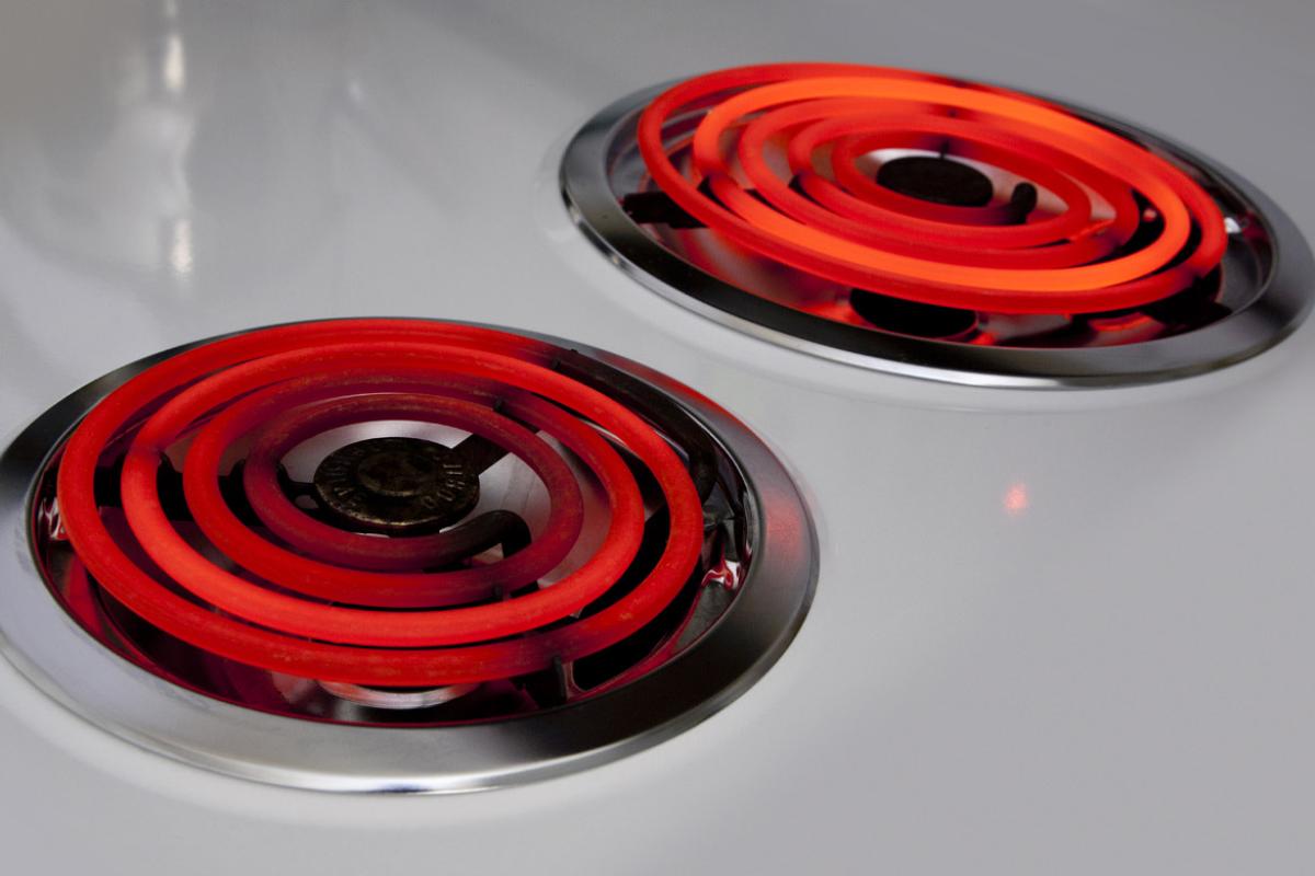Two hot electric burners on top of stove