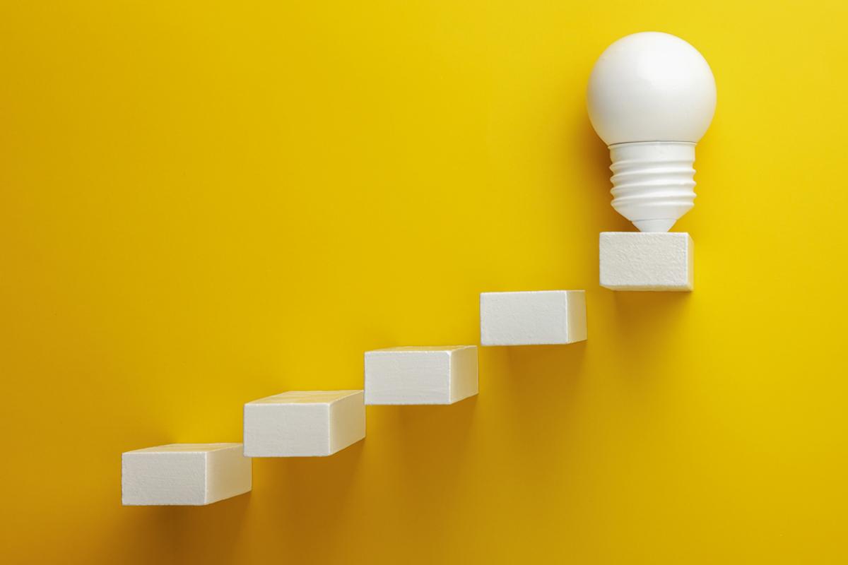 A light bulb placed on the top block of a row of ascending cube blocks