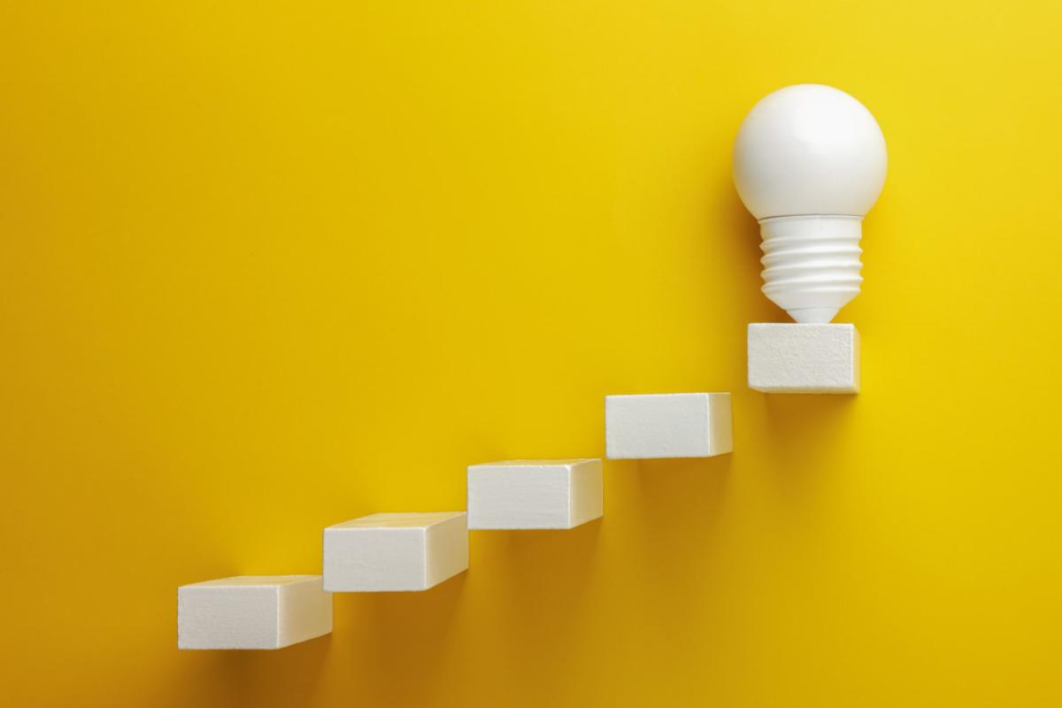 A light bulb placed on the top block of a row of ascending cube blocks