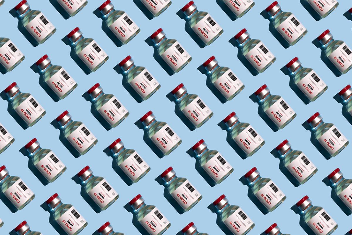 Multiple rows of vials of COVID-19 vaccine