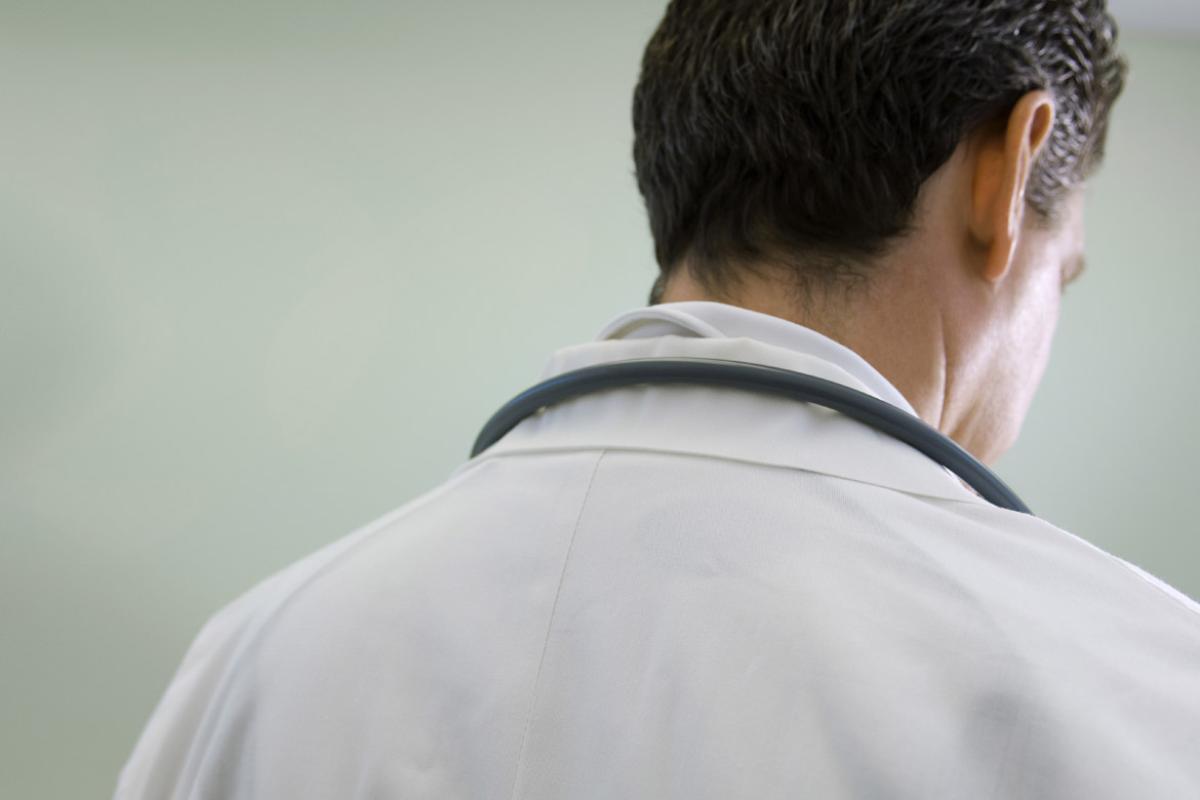 Tight shot from the back of a physician's shoulders