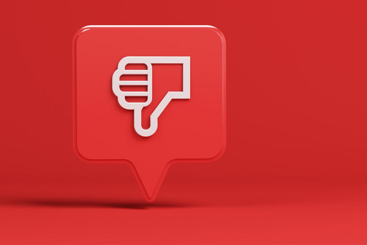 Speech or conversation bubble with a "thumbs down" illustration placed within it